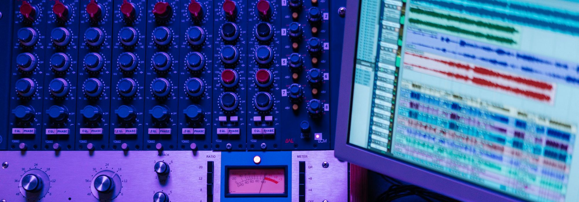 A recording studio mixing console and editing session.